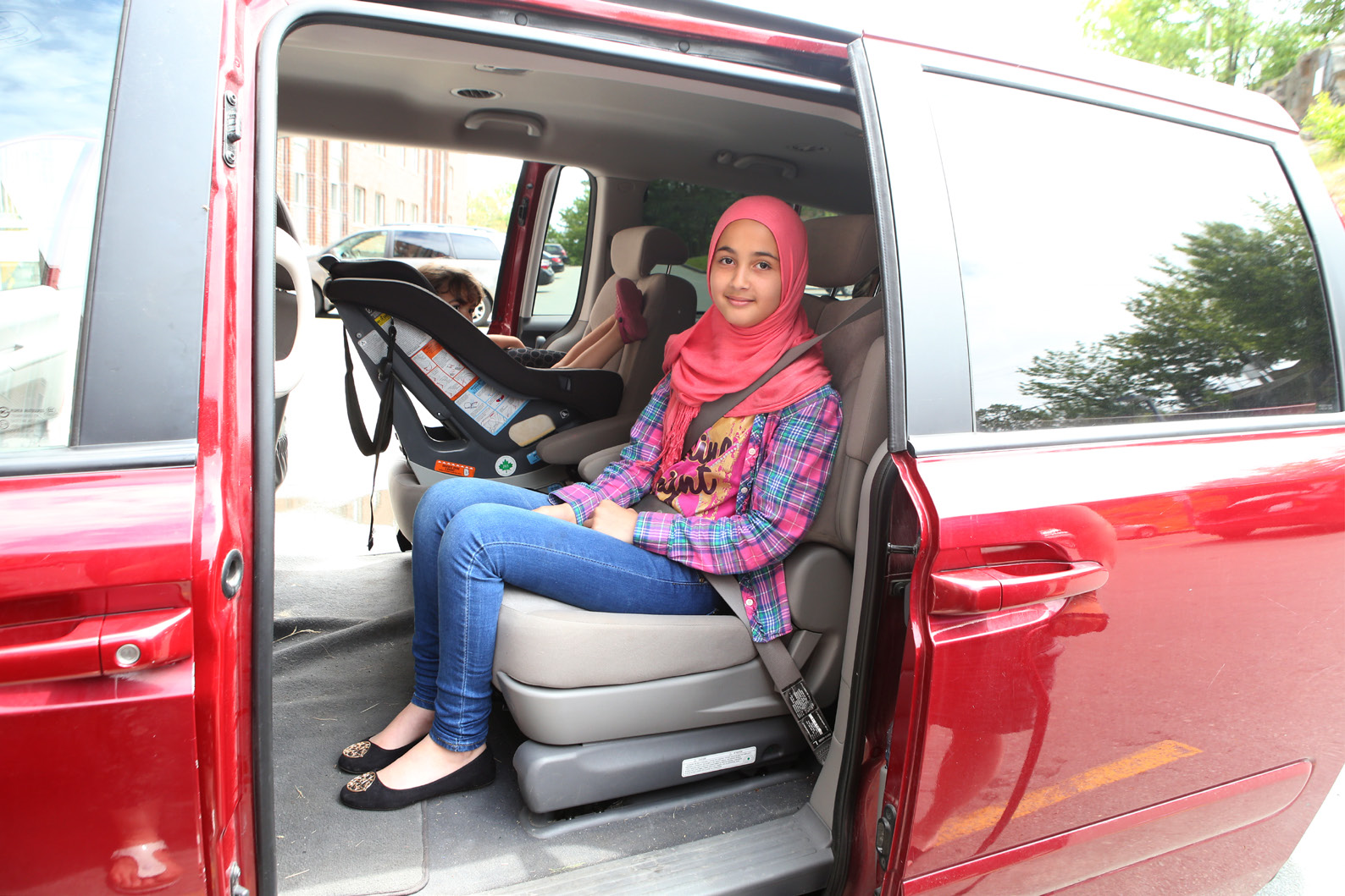 Older child using a properly fitting seat belt.