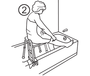 Woman sitting on a stool in the tub, lifting her affected leg over the tub wall using her hands.