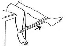 Sitting in a chair, put an elastic around both ankles and lift leg.