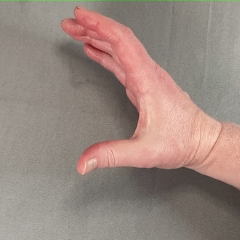 Side view of hand closing with thumb and fingers coming together, like a hand would wrap around a cup.