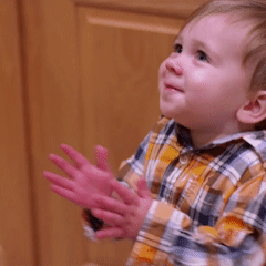 Close up of child’s hands clapping. Hands are doing the same movement.